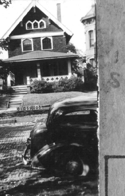 Lucas County Auditor photograph of 1115 Superior Street in 1935, showing the steep front gable, three attic windows and full-width porch