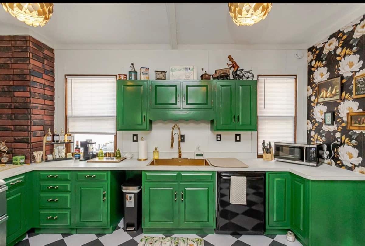 Emerald green kitchen with wood counters and island